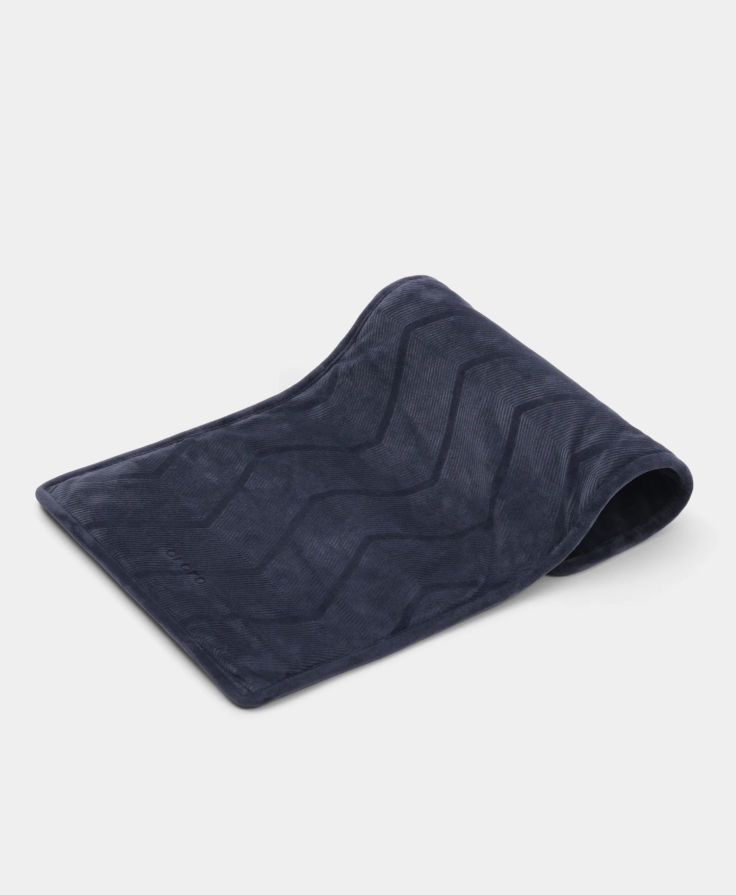 Eversoothe portable heated pad folded showing soft velvet fabric texture and compact design