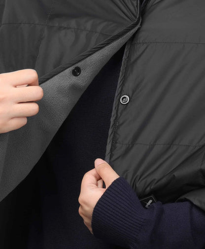 The left side of the blanket’s front features a row of plastic snaps, allowing it to be fastened and worn as a shawl.