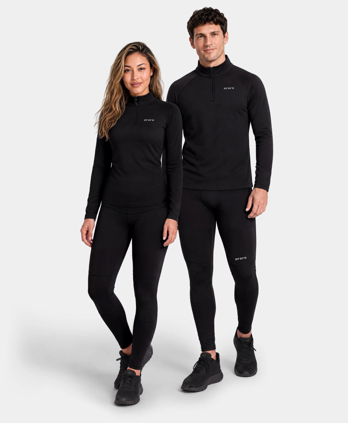 Models wearing matching black quarter-zip top and bottom
