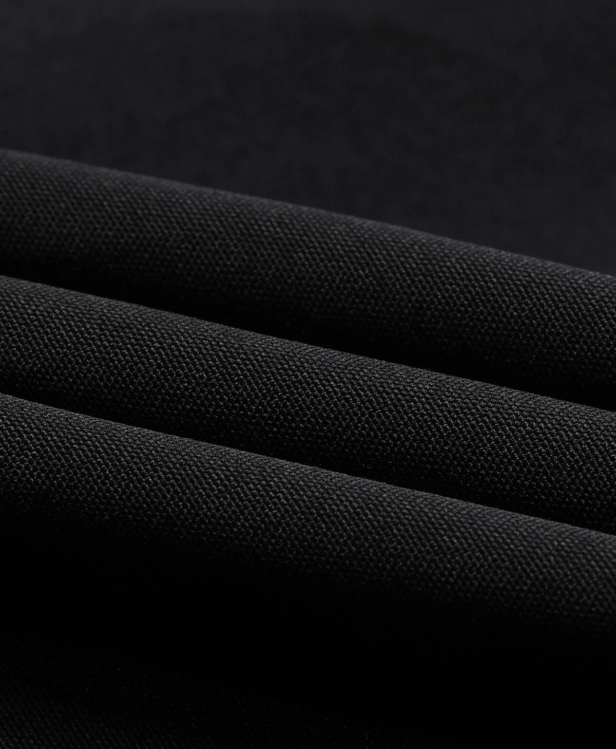 Close-up of the black fabric texture on the ororo Women's Classic Heated Jacket