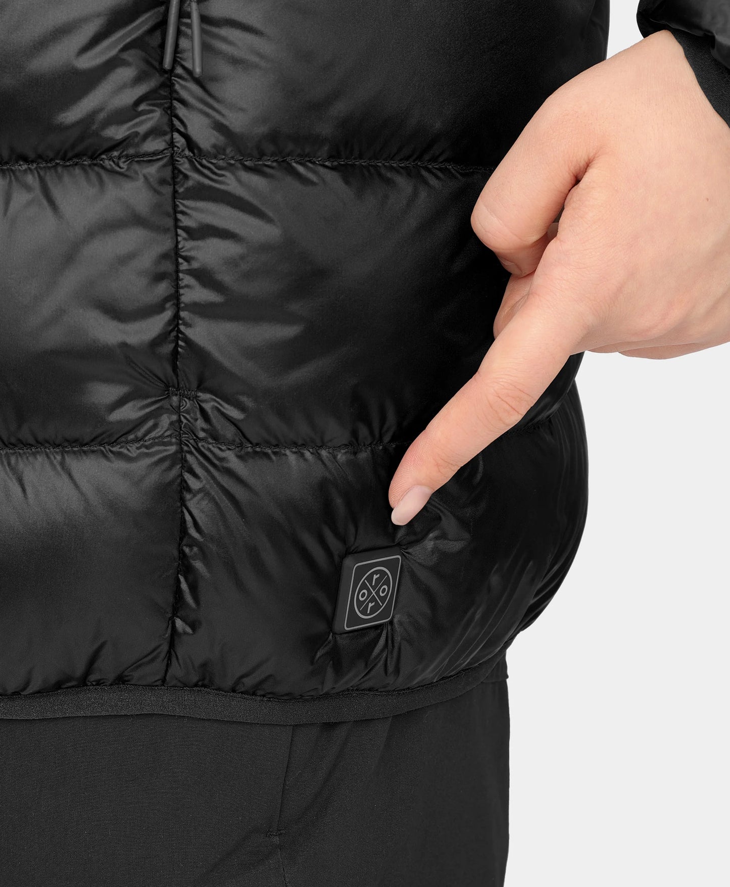 Discrete power button located near left hem