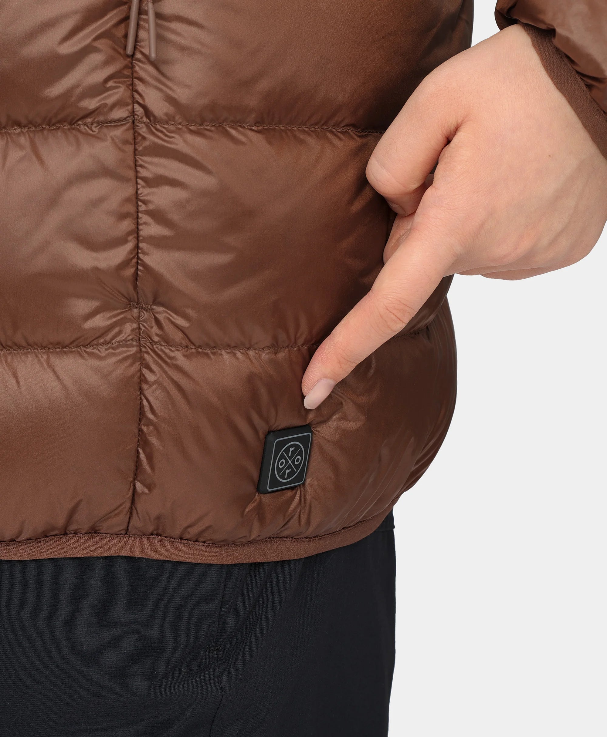 Discrete power button located near left hem