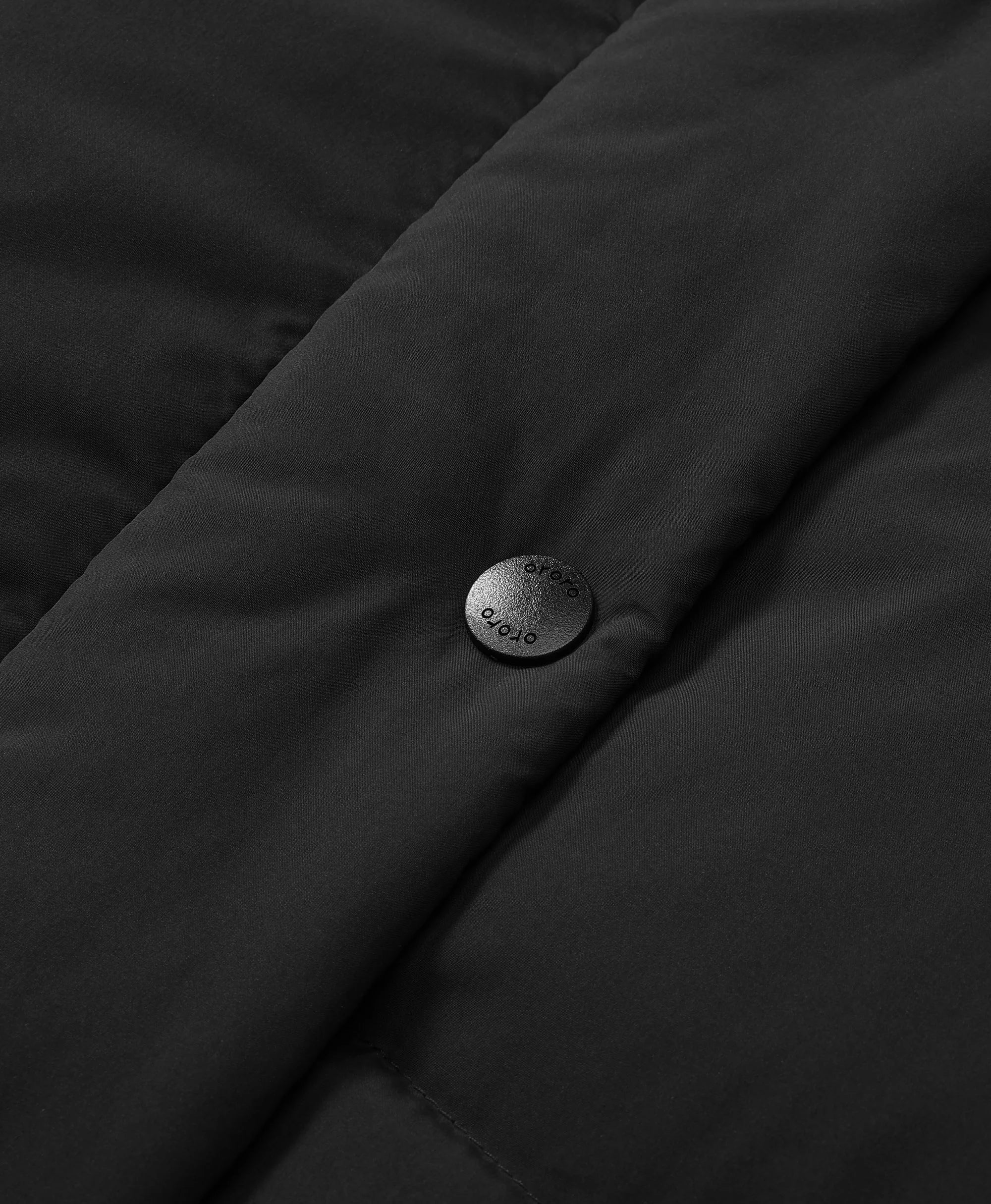 The front center features a zipper closure with a snap-button storm flap