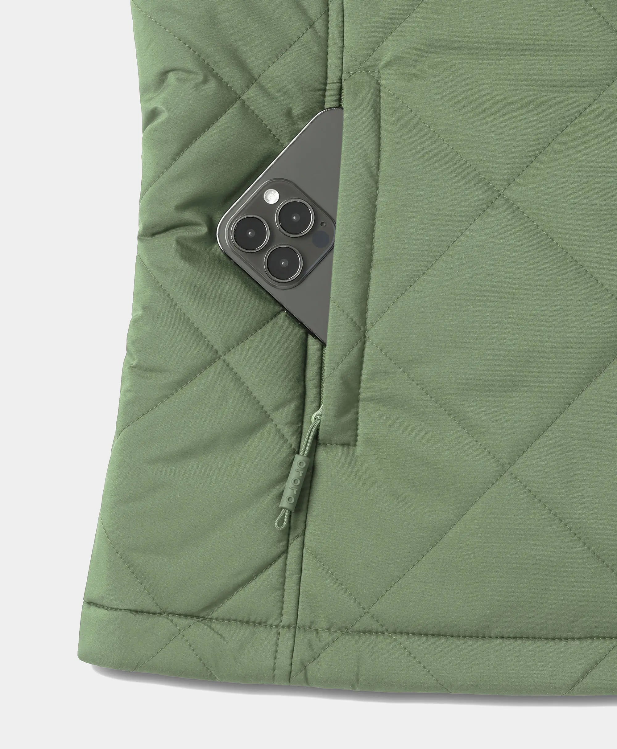 Close-up of hedge green ororo Women's Heated Quilted Vest showing a dark smartphone inside the side zippered pocket