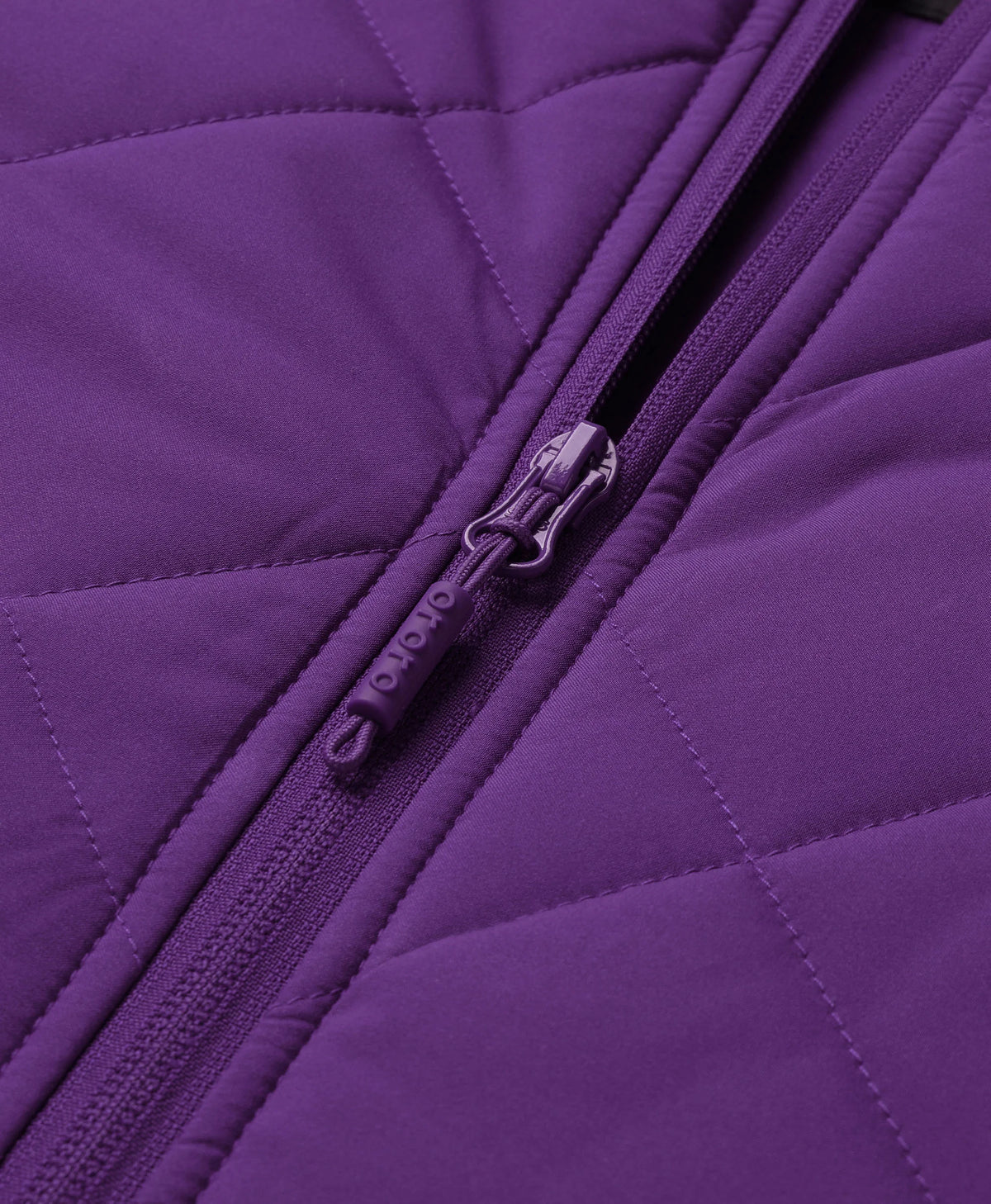 Close-up of ororo Women's Heated Quilted Vest with branded zipper pull and diamond quilting