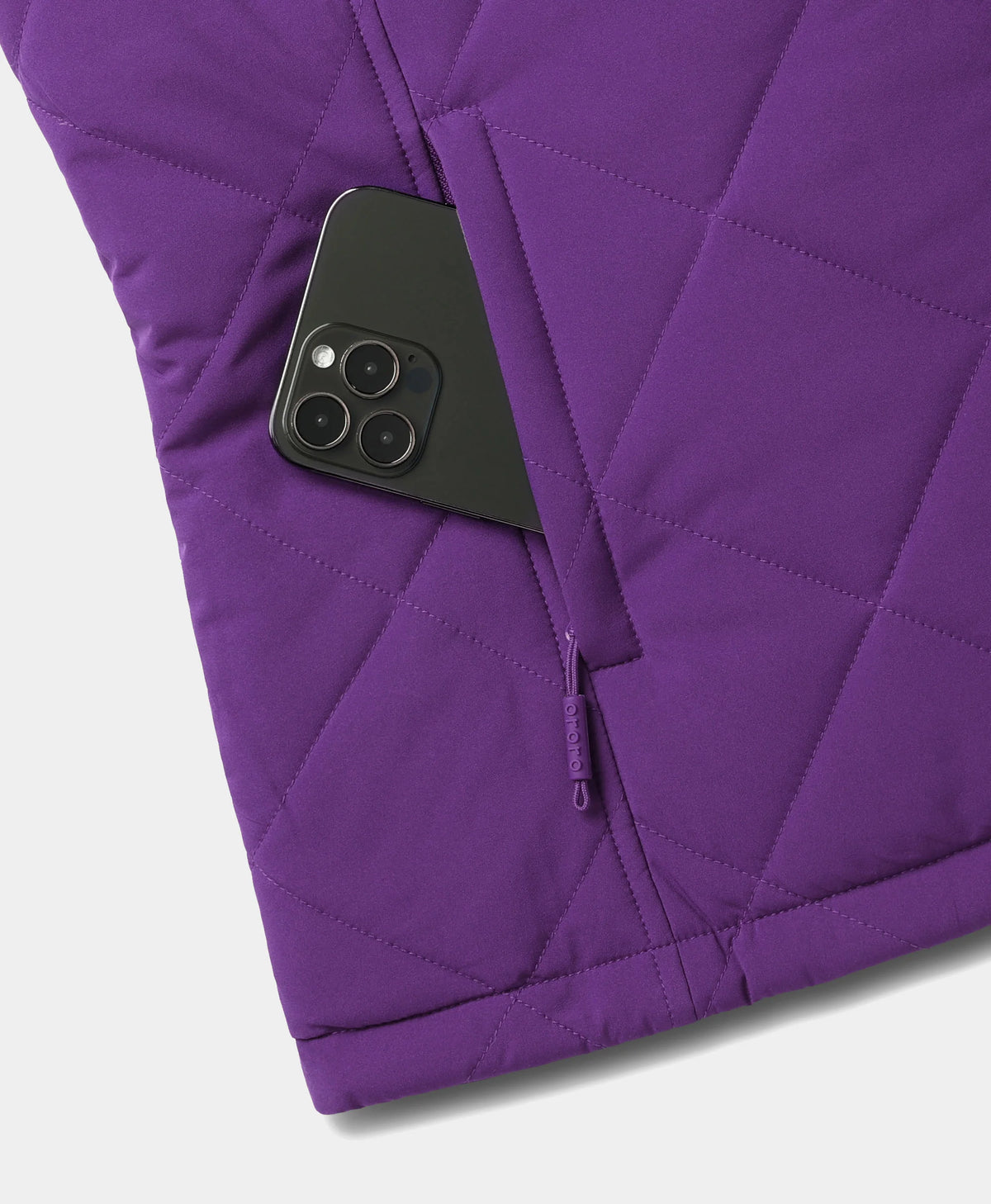 ororo Women's Heated Quilted Vest showing a smartphone placed inside the zippered side pocket