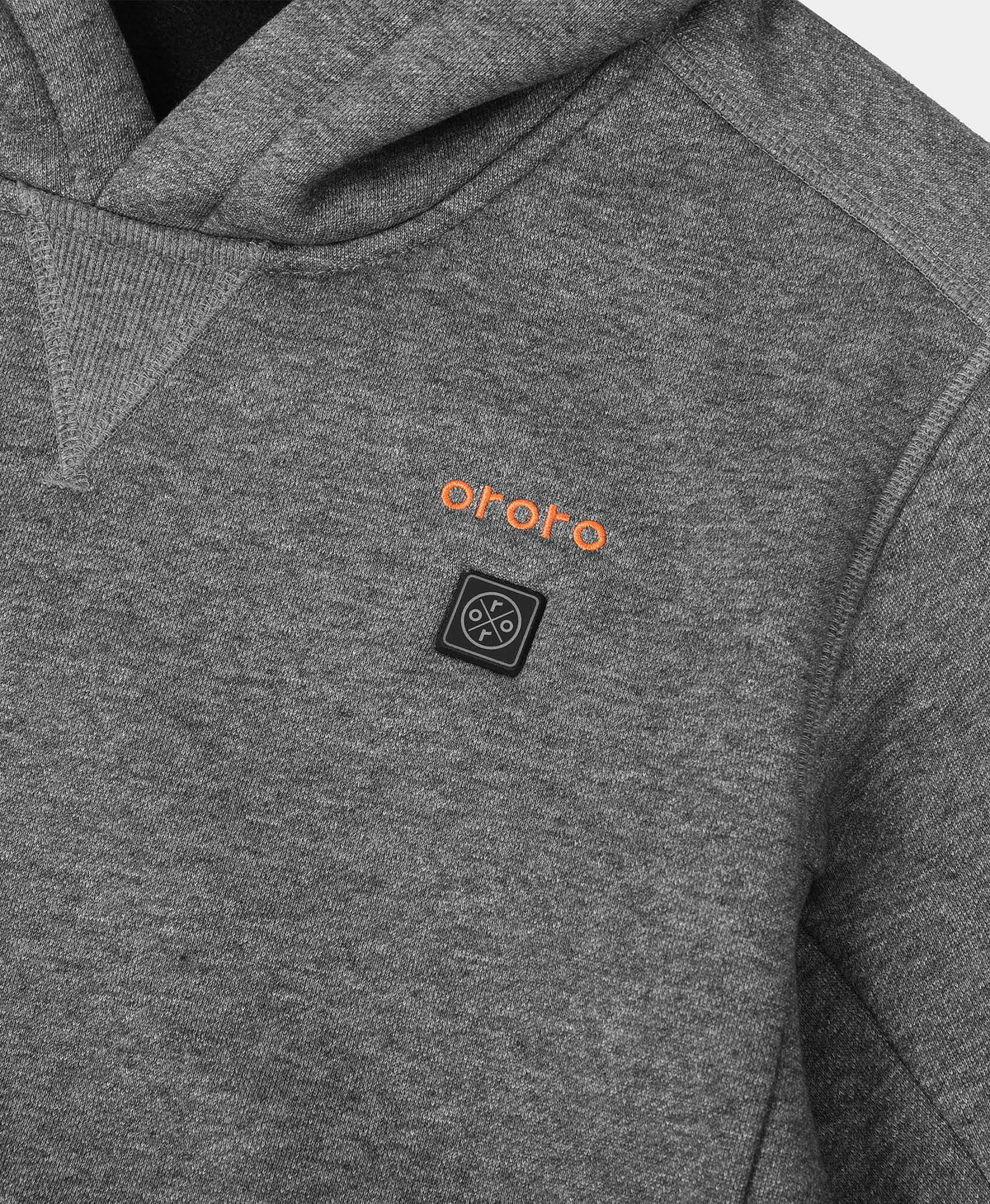 Close-up of ororo Kids' 4-Zone Heated Pullover Hoodie showing the logo button