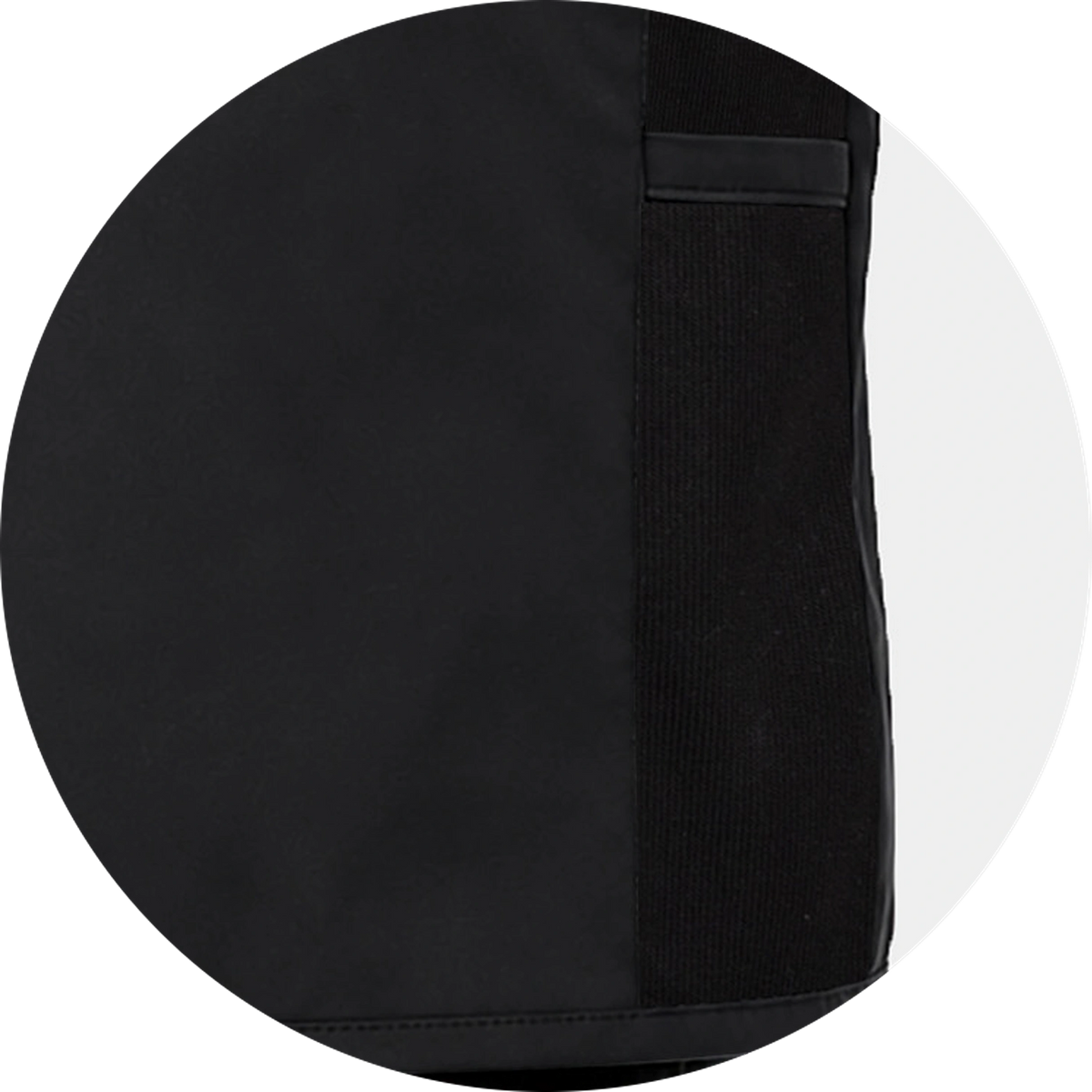 Close-up of the stretch side panel on a black vest