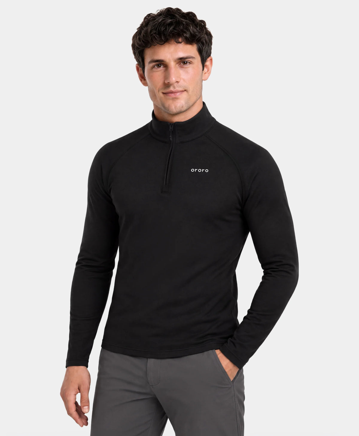 Man wearing ororo men's black long-sleeve heated thermal base layer top against a light gray background