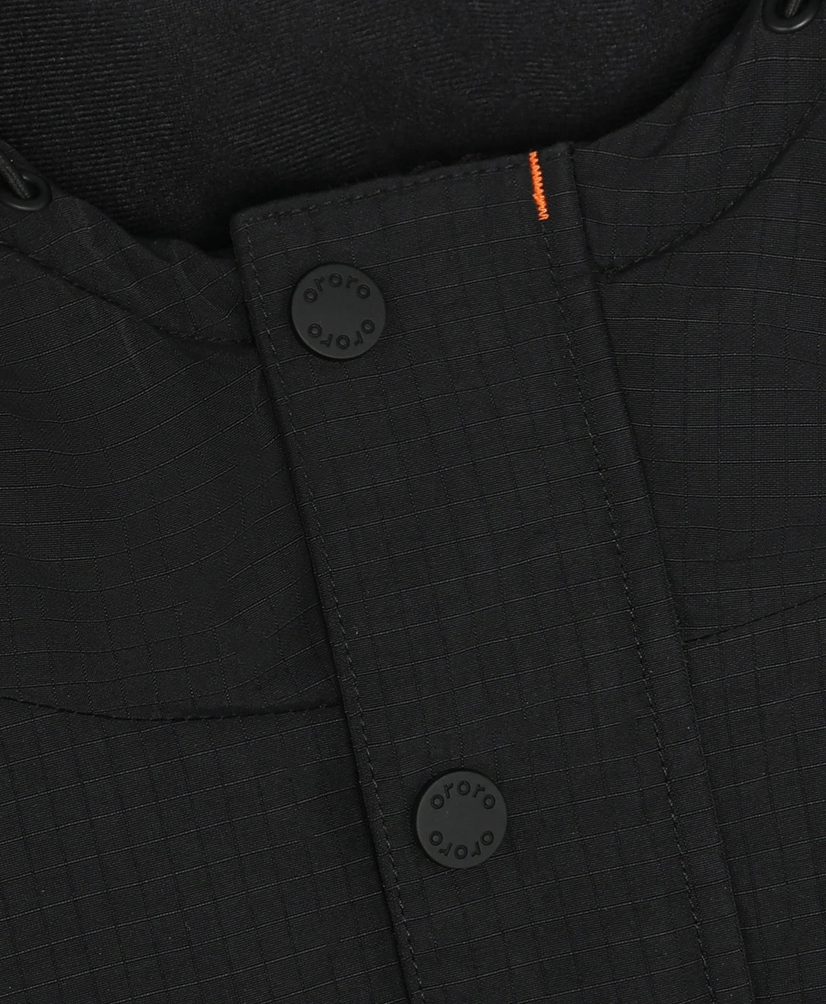 Close-up of a black textured ororo heated jacket with a buttoned collar, black buttons