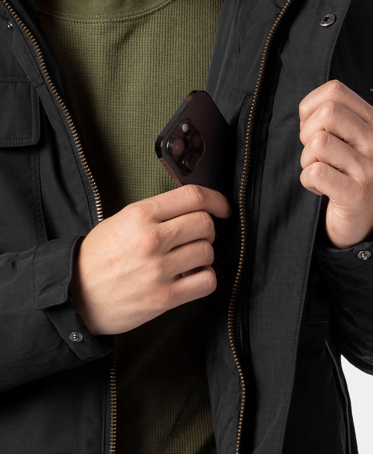 Men's heated jacket pocket designed to hold everyday essentials