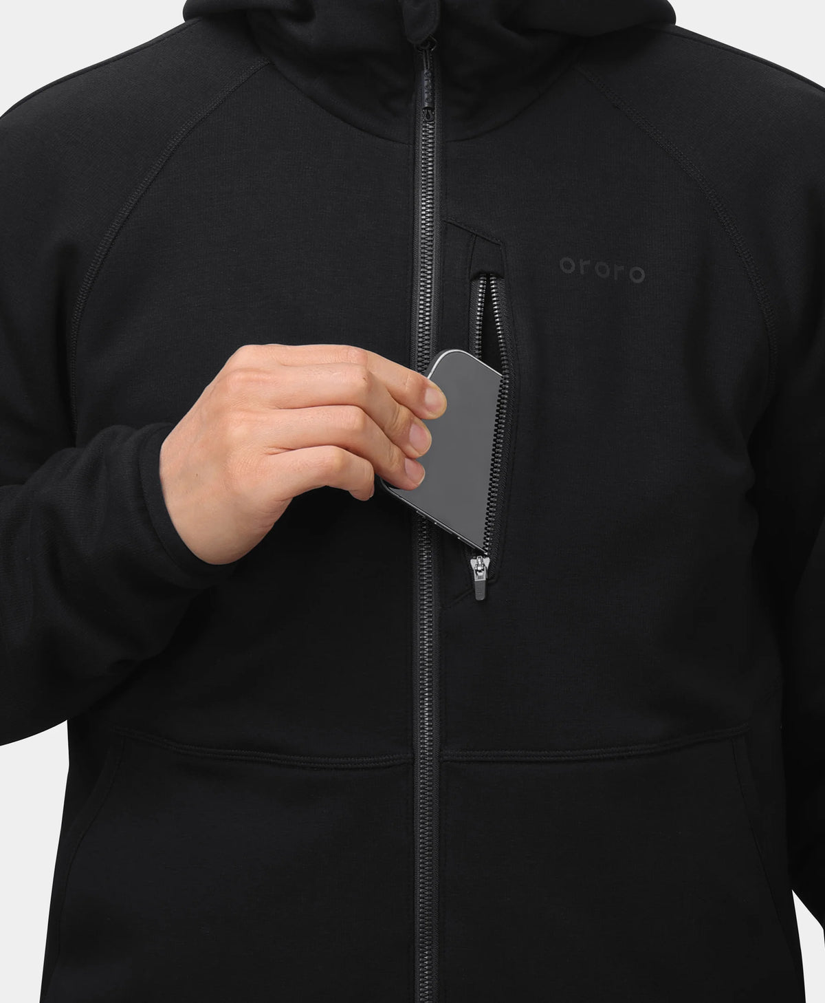 Close-up of Men's 5-Zone Heated Tech Fleece Jacket with smartphone being placed in the zippered chest pocket