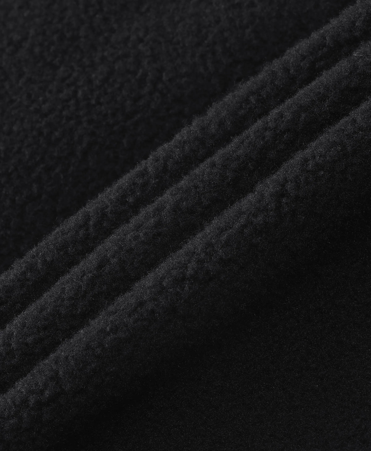 Close-up of the soft brushed fleece texture of the Men's 5-Zone Heated Tech Fleece Jacket