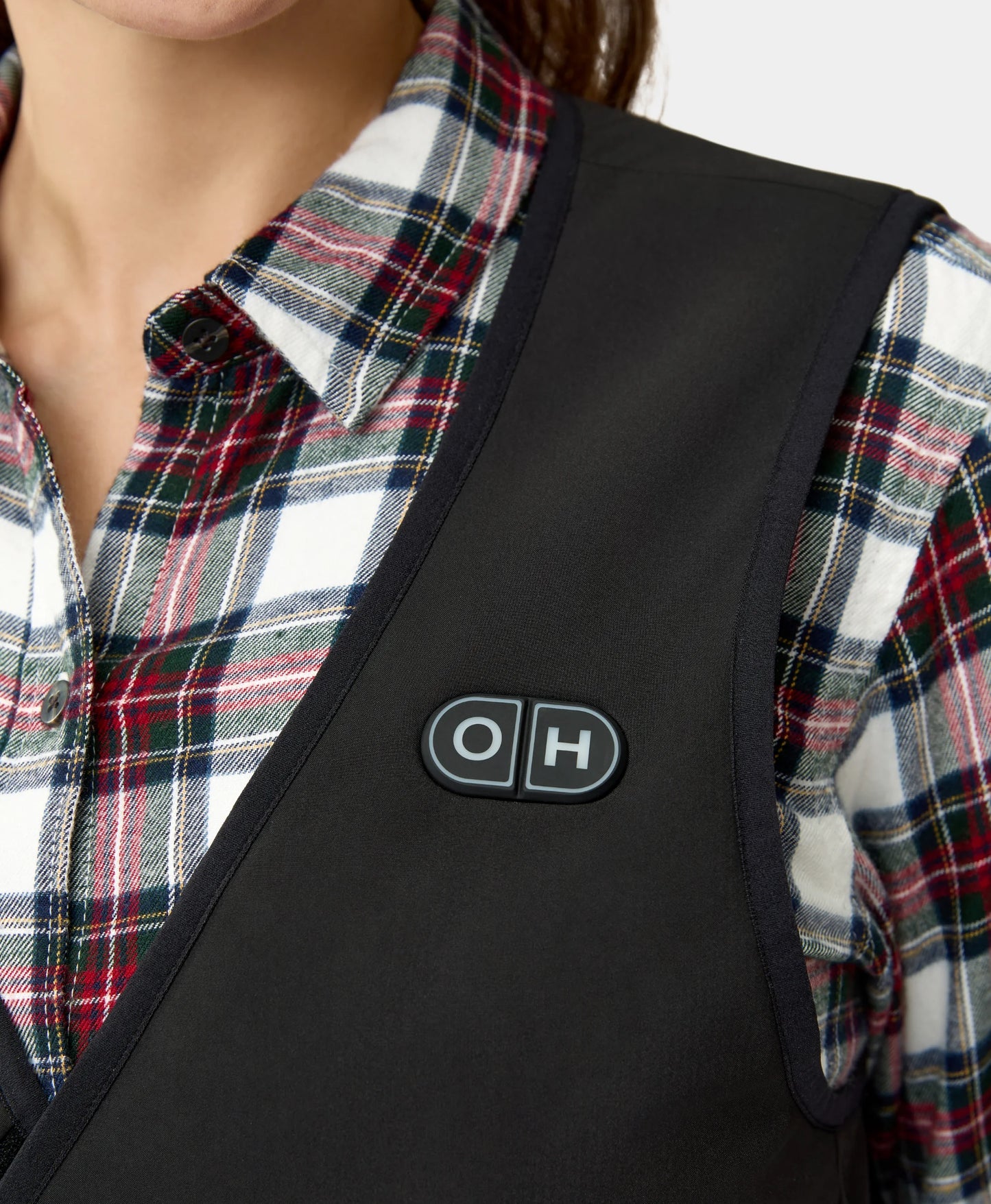 The button switch on the chest area- female model