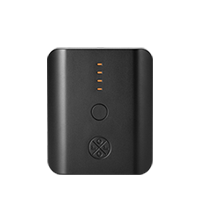 A black rectangular portable ororo PD 5K power bank with rounded corners, featuring four illuminated orange LED indicator lights, a central button, and a circular logo near the bottom, shown on a plain white background.