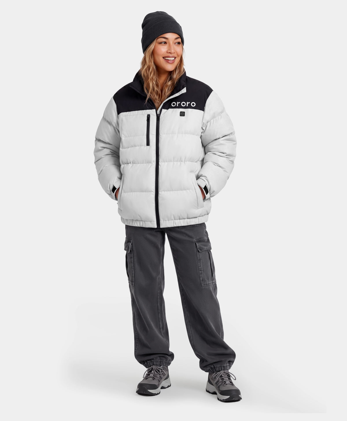 Woman wearing black and white puffer jacket full view