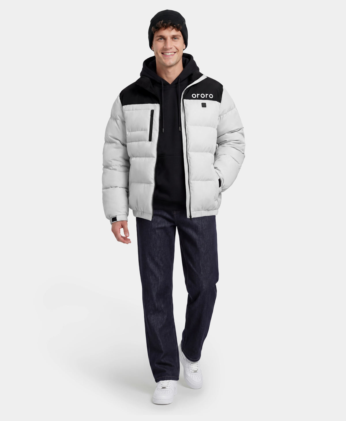 Man wearing black and white puffer jacket full view
