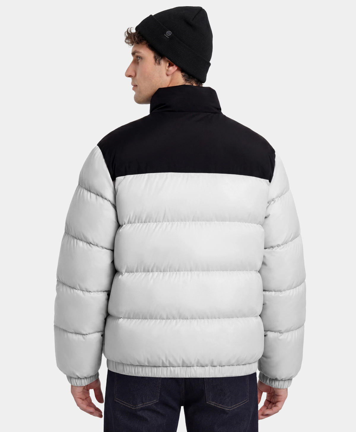 Man wearing black and white puffer jacket back view