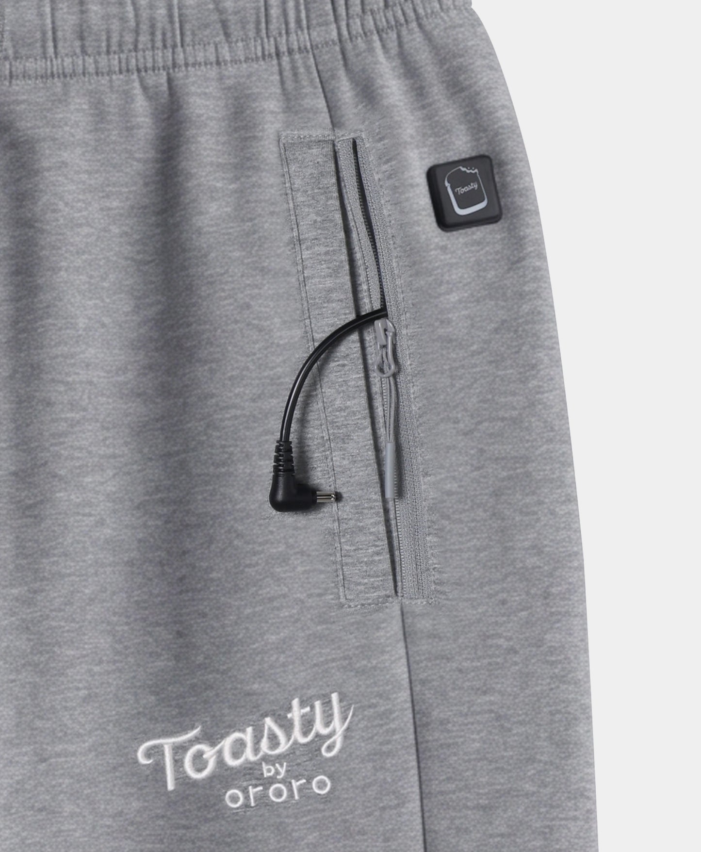 Close-up of Flecking Gray Toasty Heated Sweatpants showing side pocket, power button, and Toasty by ororo logo