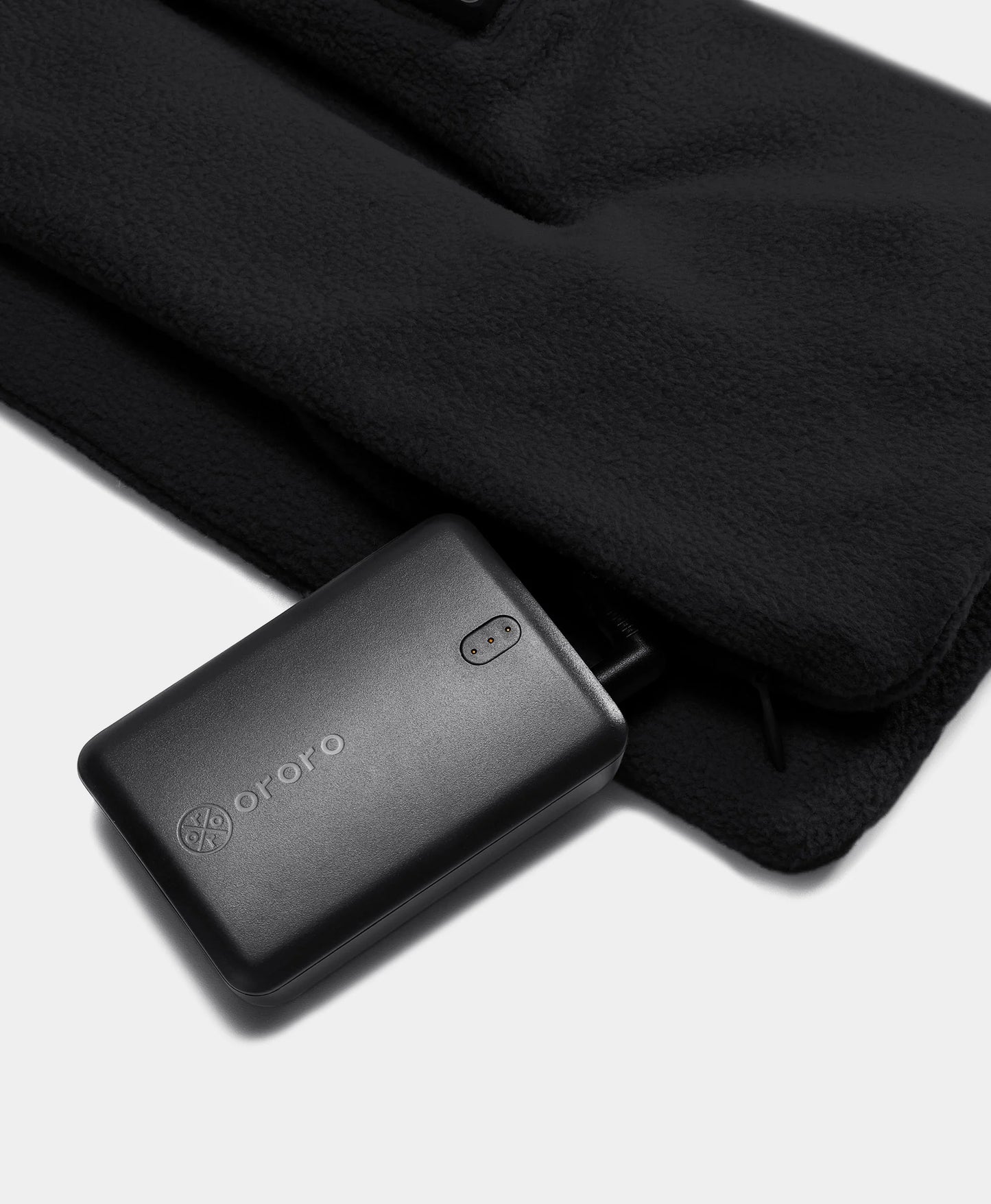 Battery located at bottom of scarf in hidden zipper pocket