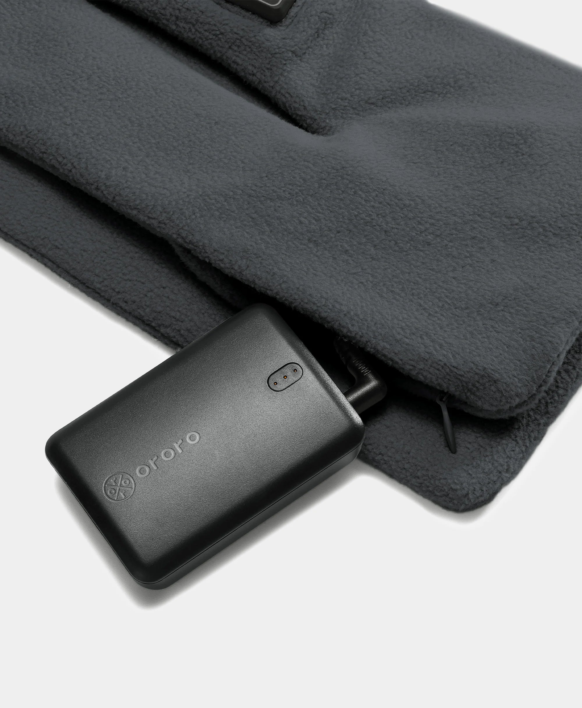 Battery located at bottom of scarf in hidden zipper pocket